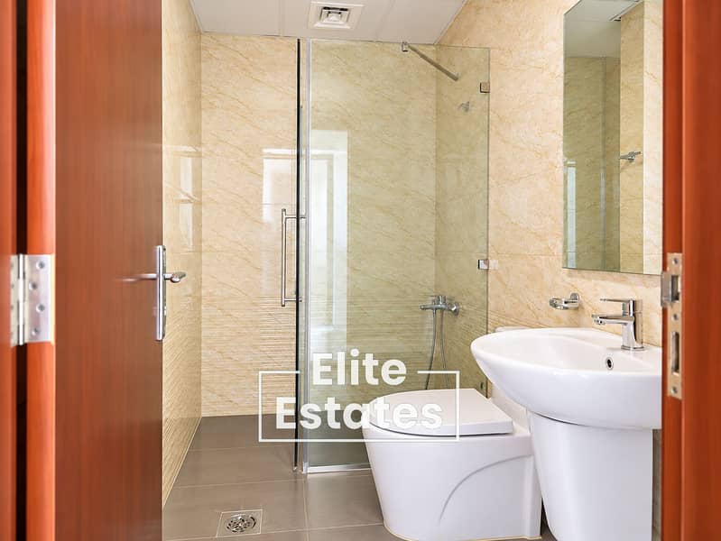 6 Bright Modern Bathroom Through Wooden Door. png