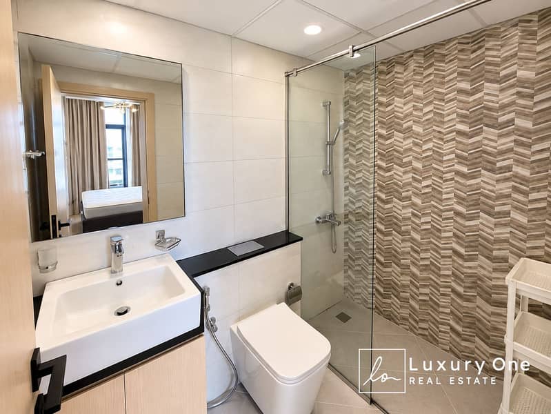 10 Modern Neutral Bathroom with Chevron Shower Tiles. png