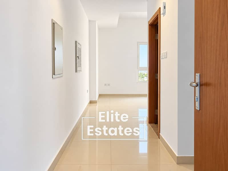 2 Modern Hallway with Open Wooden Door. png