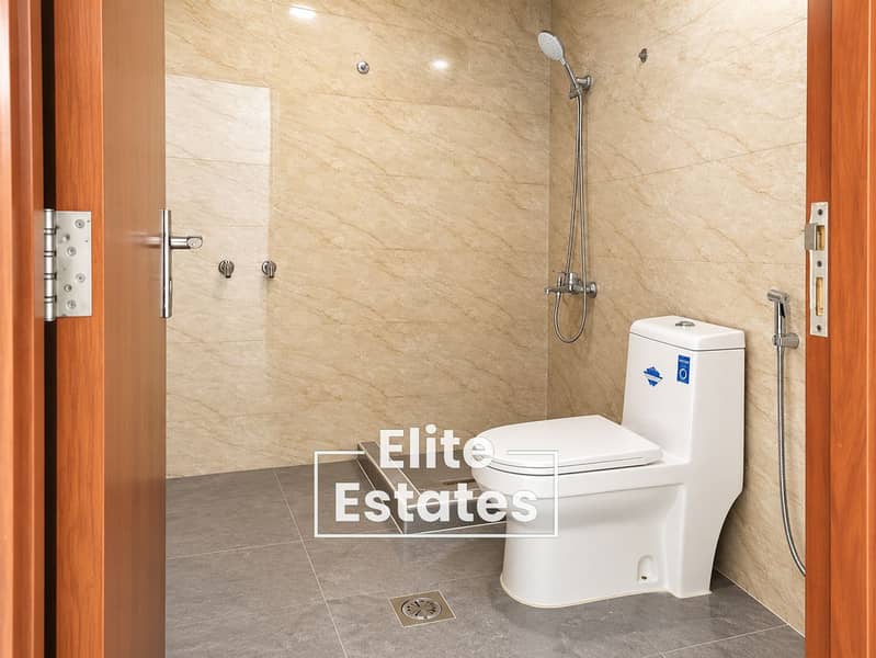 5 Modern Beige-Tiled Ensuite Bathroom. png