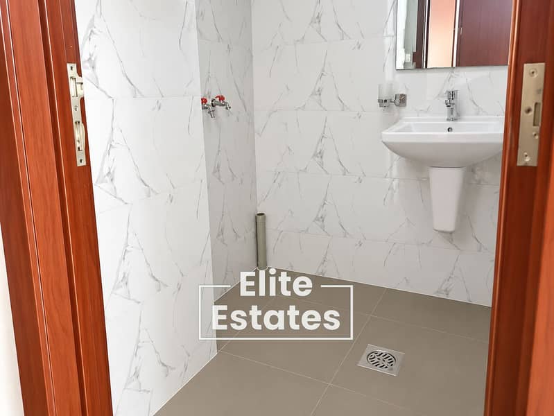 6 Modern Marble-Tiled Bathroom Interior. png