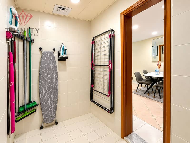 7 Bright Organized Utility Room with Ironing and Storage. png
