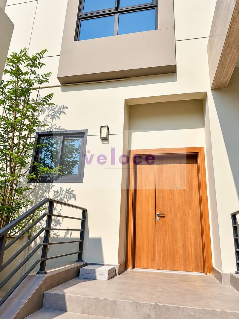 2 Modern Cream Entryway with Wood Door. png