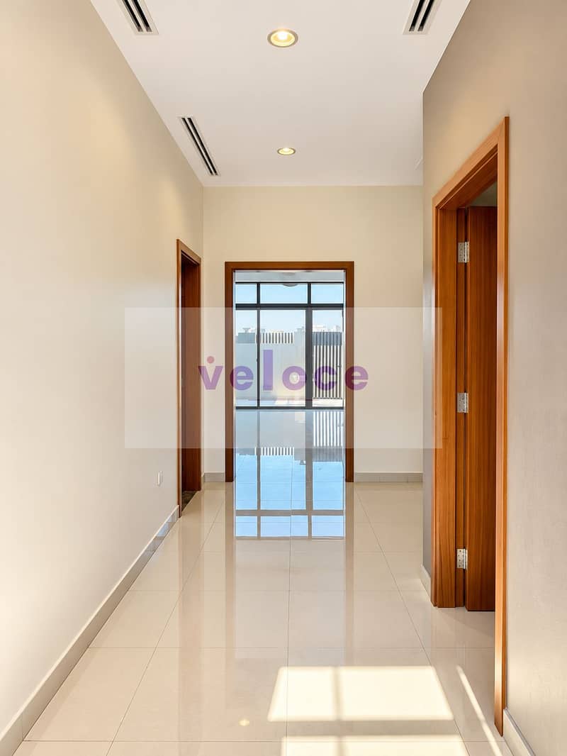 10 Sunlit Minimalist Hallway with Urban View. png