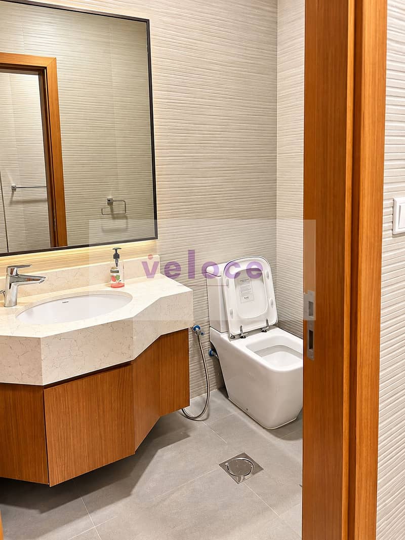 14 Modern Wood-Toned Powder Room. png