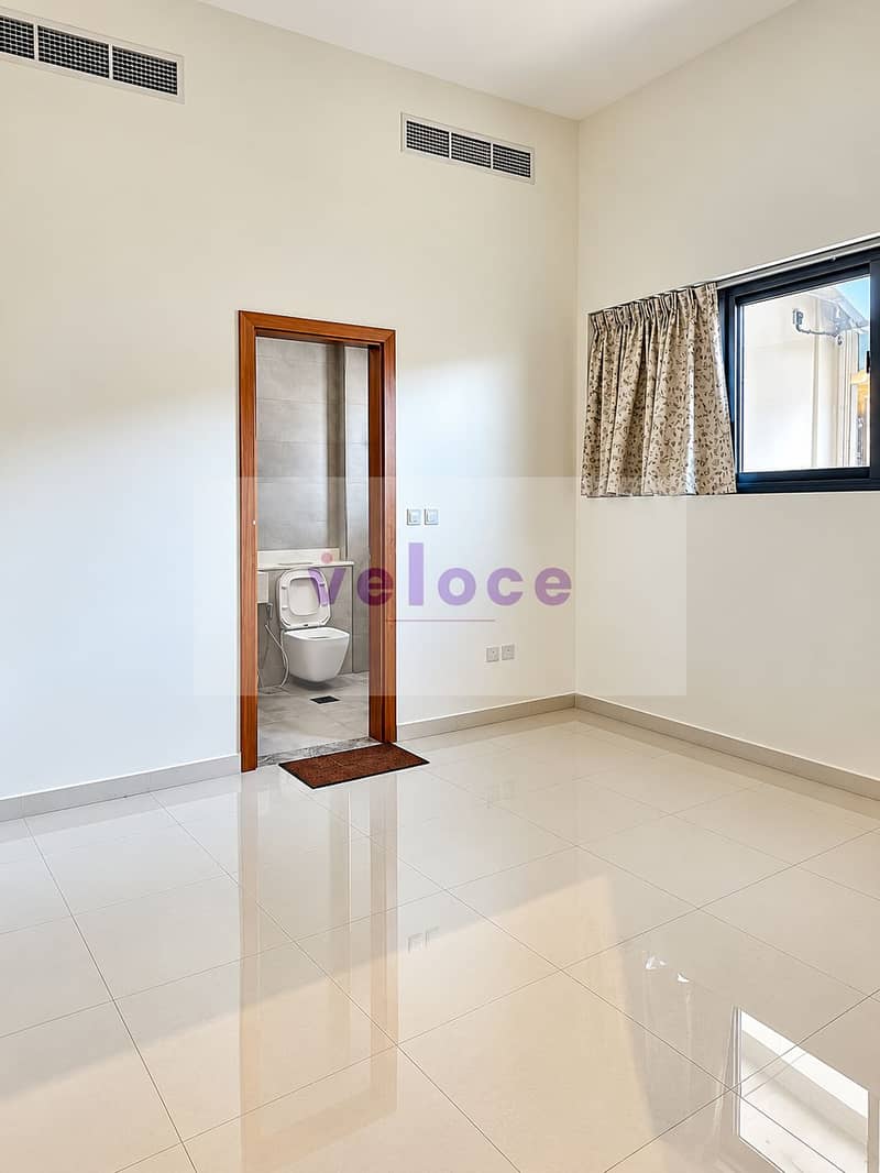 18 Bright Minimalist Room with Bathroom Entry. png