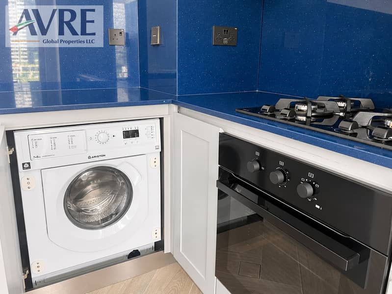10 Modern Blue Kitchen with Integrated Appliances. png