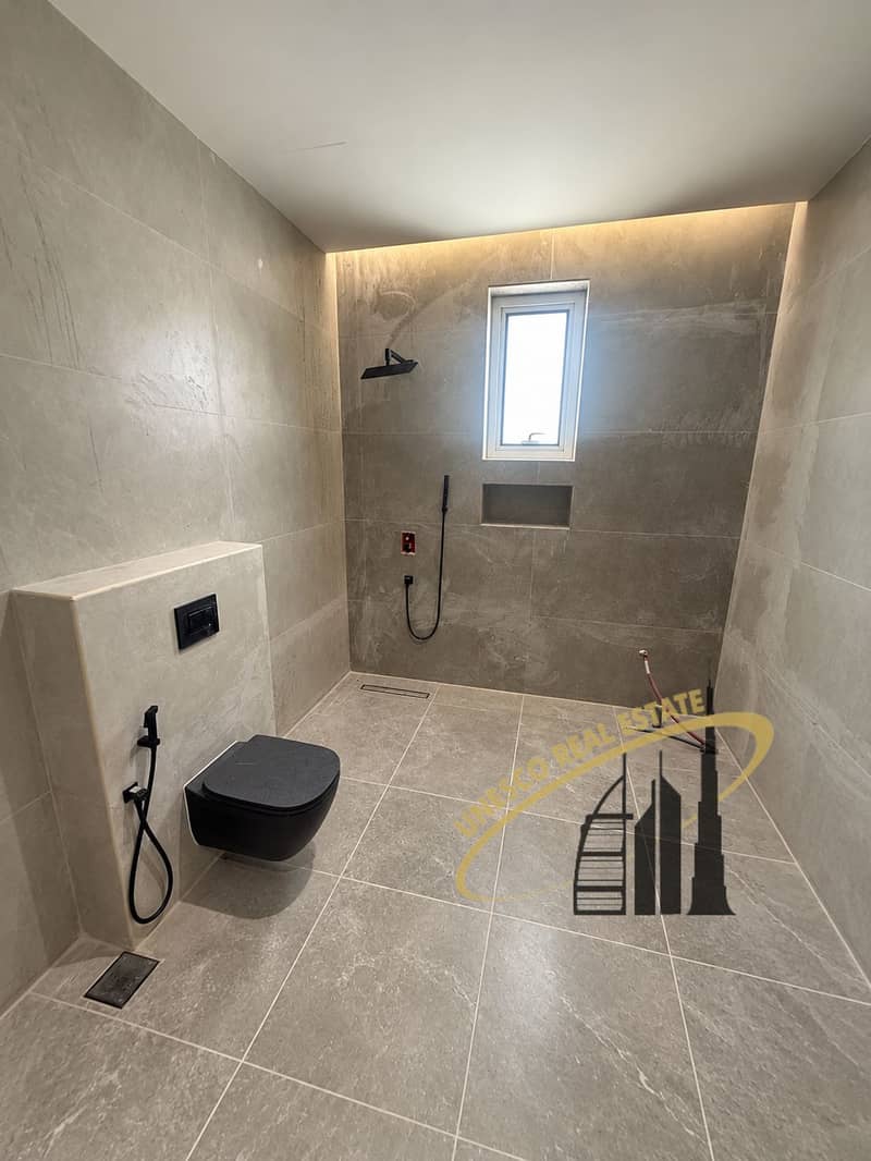 15 Large gray bathroom with black toilet-7. png