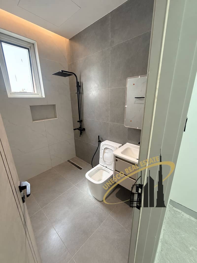 17 Small gray bathroom with open toilet-2. png