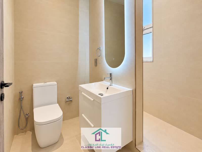 11 Modern Minimalist Beige-Tiled Bathroom. png
