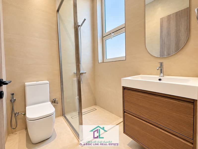 12 Pristine Minimalist Beige Tile Bathroom. png