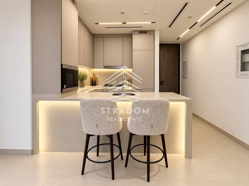 5 Warm Minimalist Kitchen with Breakfast Bar. png
