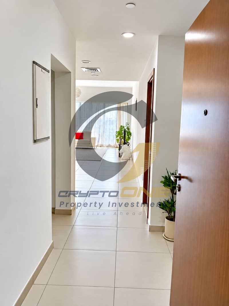 2 13_bright_modern_hallway_with_red_accent_sofa. png