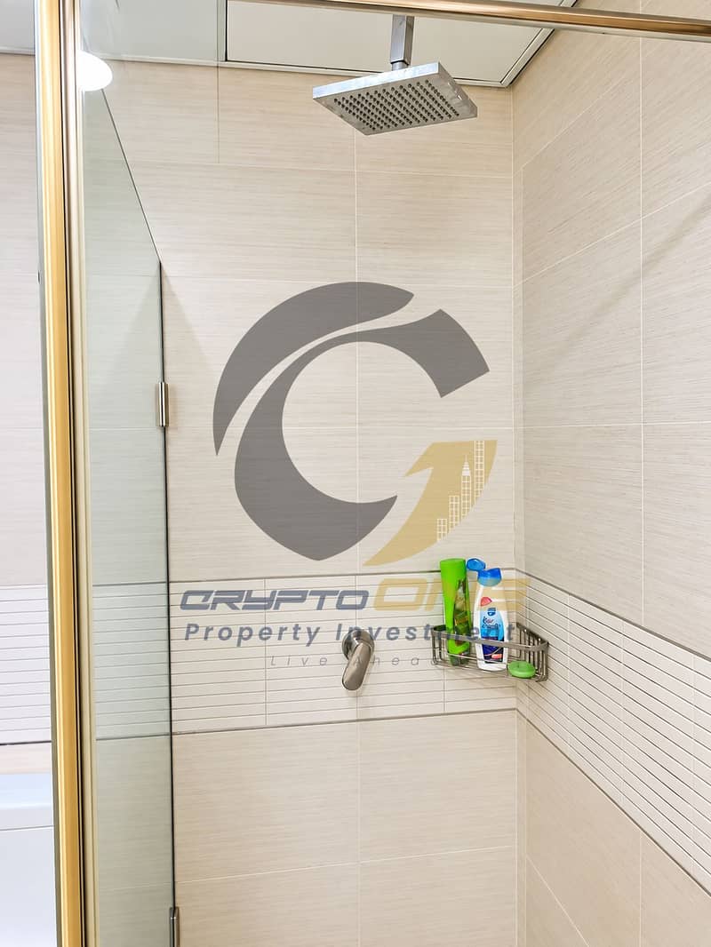 21 08_modern_beige_tiled_shower_with_brass_accents. png
