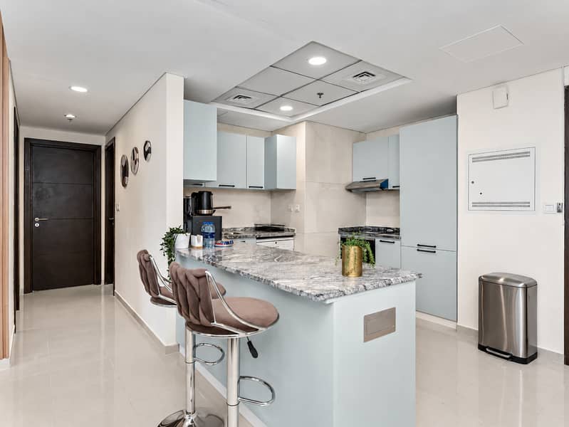 14 Clean Modern Kitchen and Hallway. png