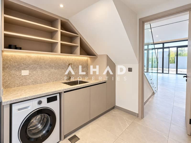 11 Luxurious Under-Stair Laundry Nook. png
