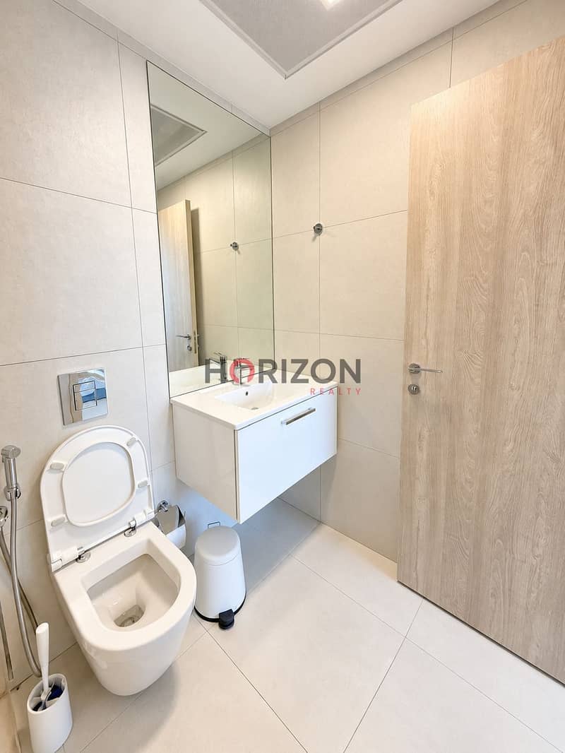 11 Minimalist Beige Bathroom with Oak Door. jpg