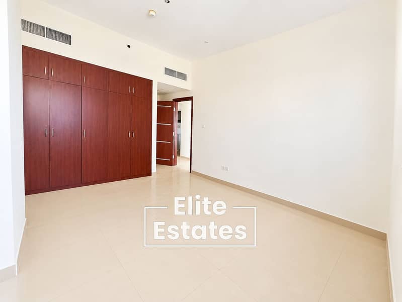 4 Minimalist Bedroom with Built-In Wardrobe and Open Door. png