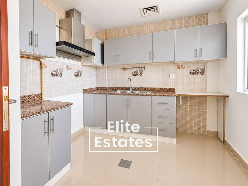 5 Bright Modern Kitchen with Mosaic Backsplash. png