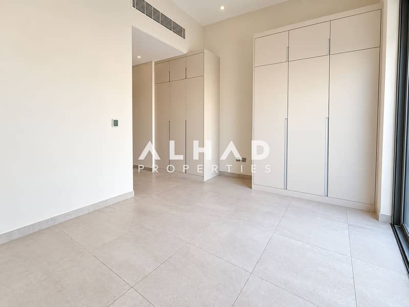 5 Minimalist Beige Walk-In Wardrobe Interior. png