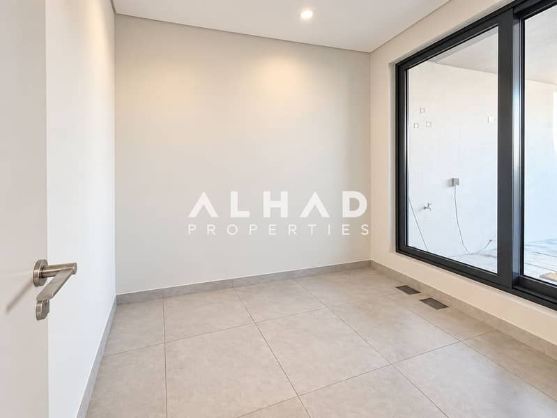 6 Minimalist Cream-Tiled Room with Glass Door. png