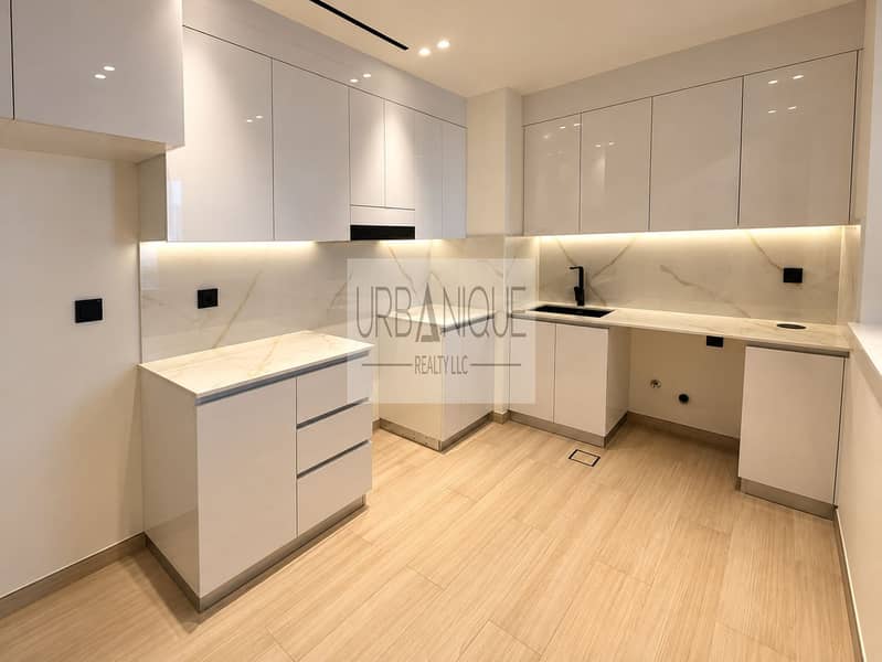2 Modern Marble Kitchen with Warm Lighting. png