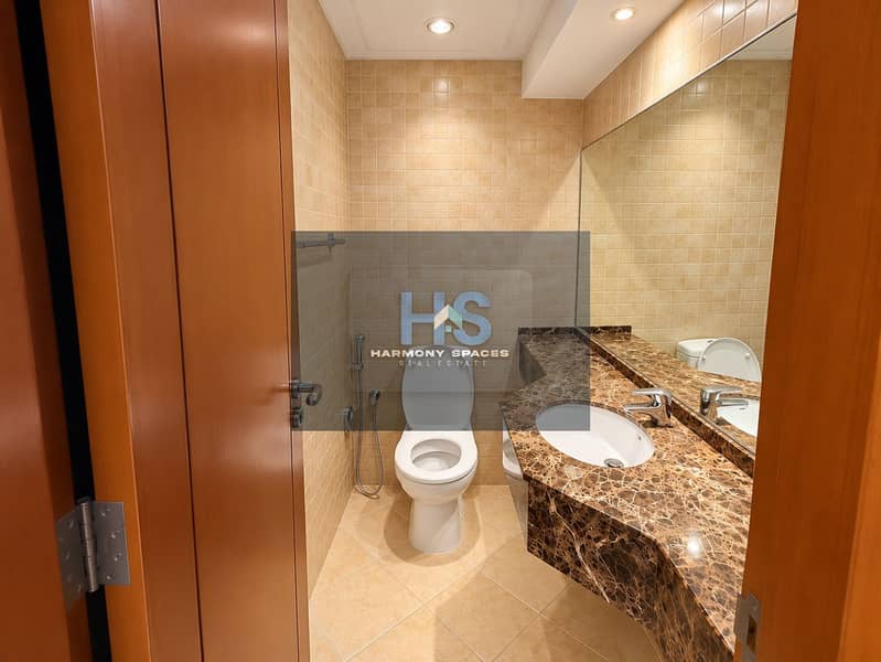 7 Bright Modern Beige-Tiled Powder Room. png