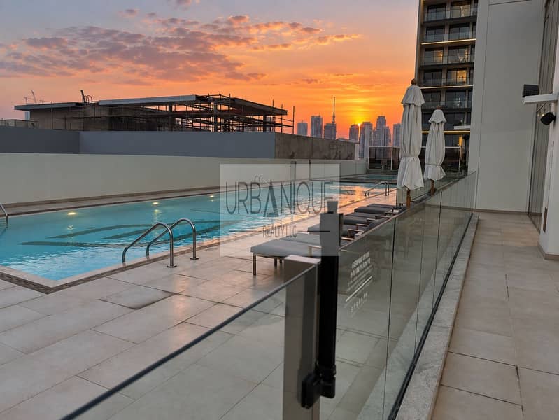 18 Sunset Rooftop Pool Overlooking the City. png