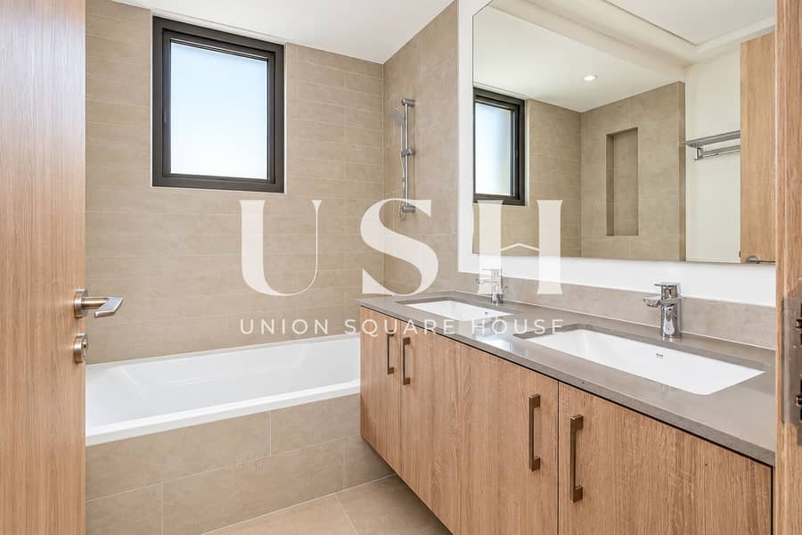 13 Modern Beige Bathroom with Double Vanity. png