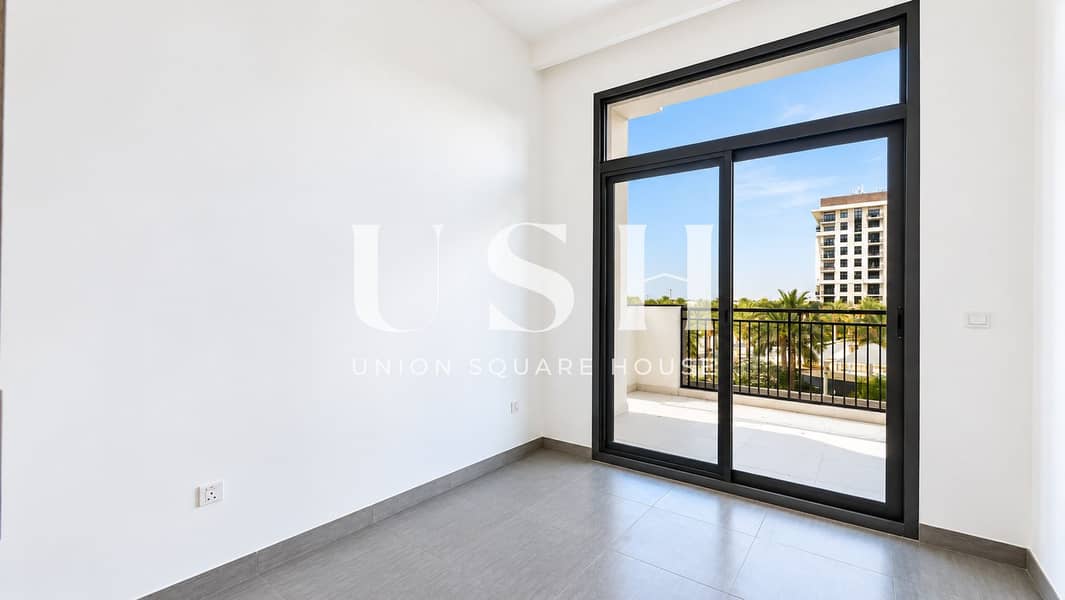 17 Modern Room with Sunny Balcony View. png
