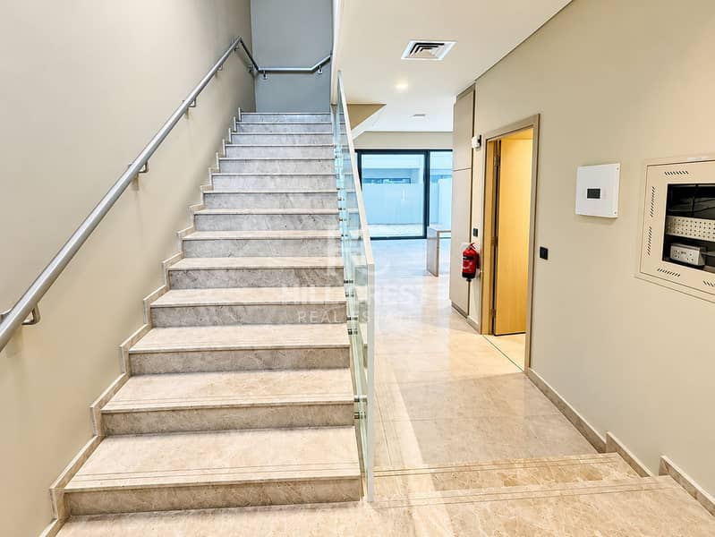 13 Modern Marble Stairwell and Glass Corridor. png