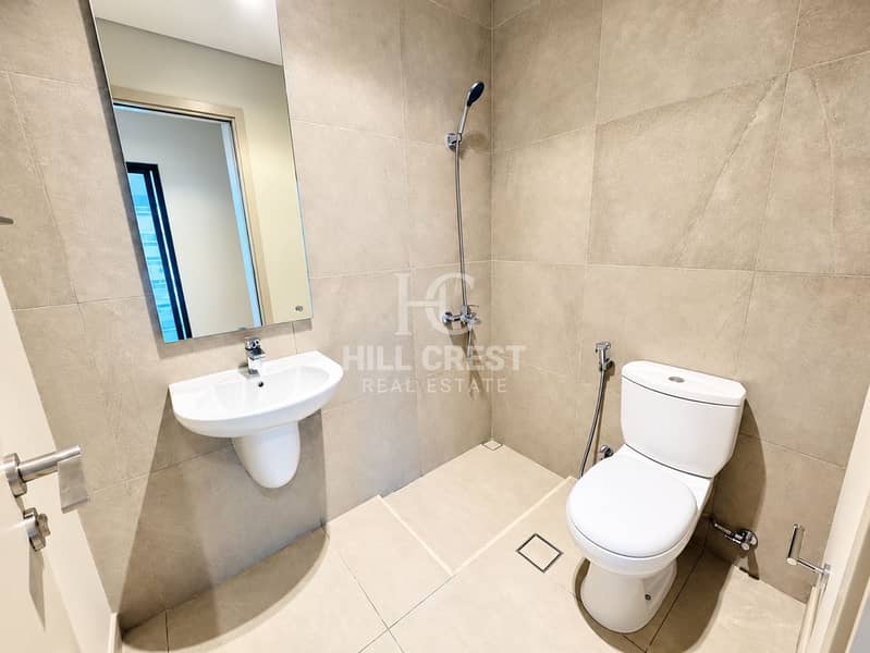 27 Modern Beige Tiled Bathroom. png