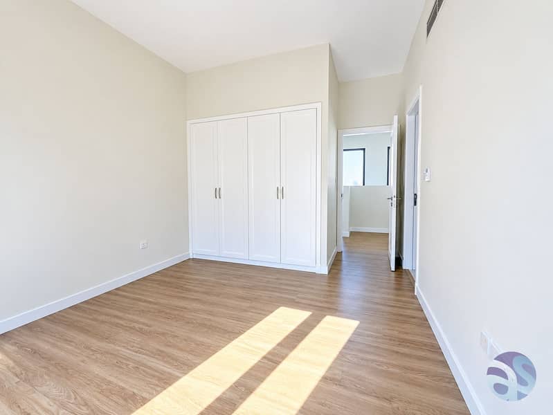 25 Sunlit Minimalist Room with Built-In Wardrobe. png