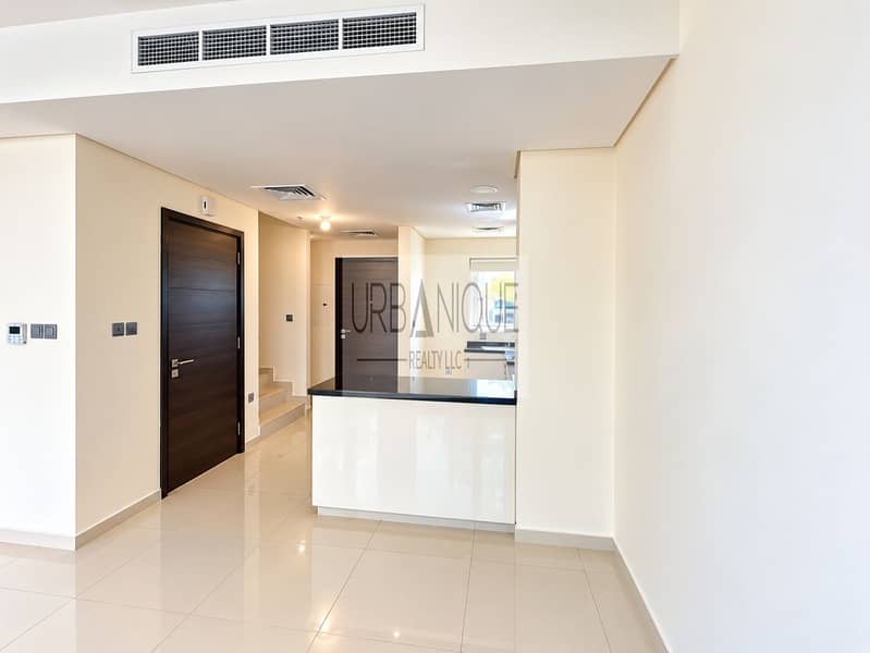 2 Bright Minimalist Apartment Hallway and Kitchen. png