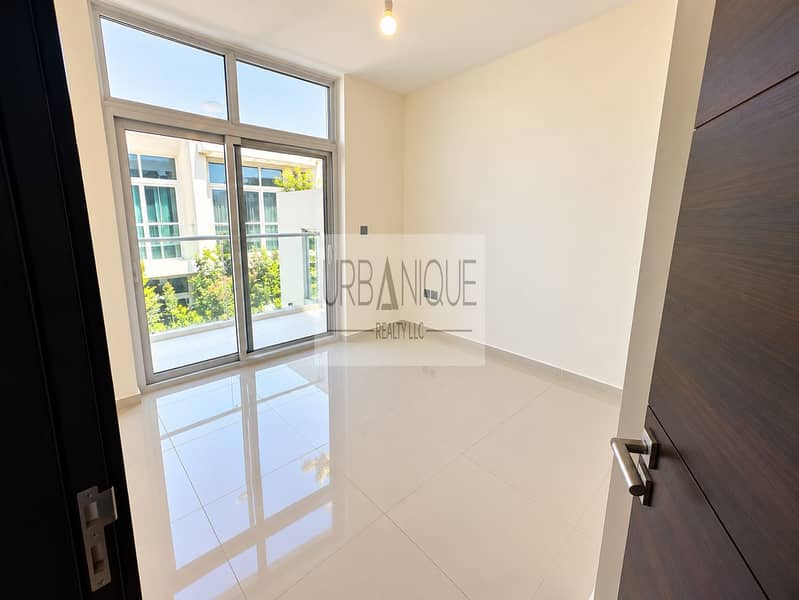 4 Bright Minimalist Room with Balcony Views. png