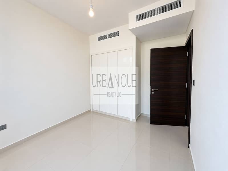 6 Bright Minimalist Room with Wardrobe and Open Door. png