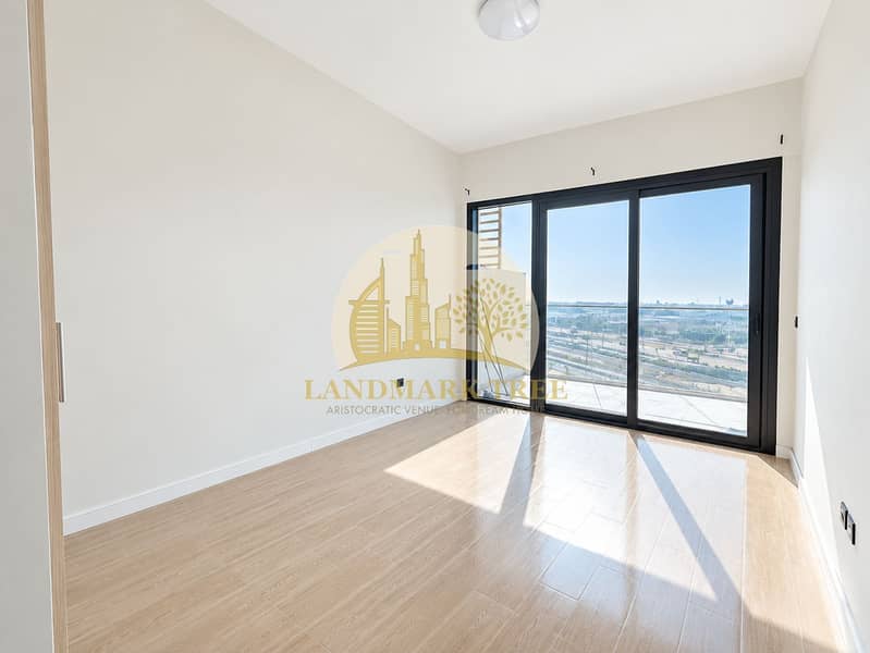 8 Sunlit Empty Room with City View. png