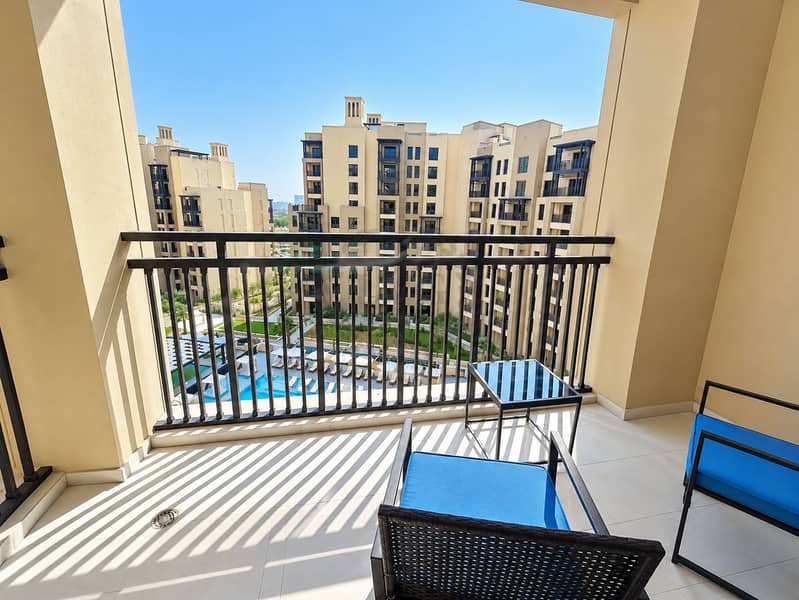 8 Sunny Balcony Overlooking Resort Courtyard. png