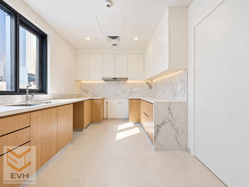 11 Bright kitchen interior with garden views-1. png