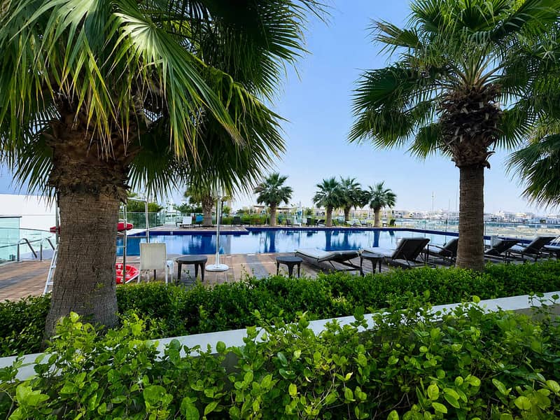 10 Damac Hills 1BR Apartment with Pool & Balcony
