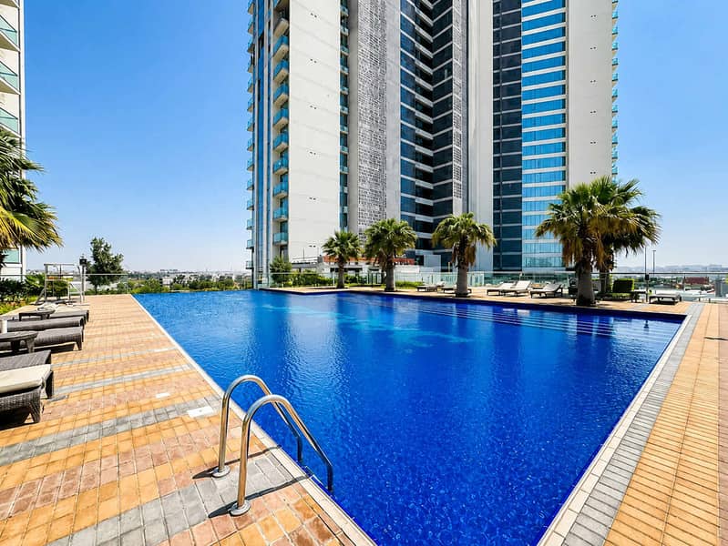 11 Damac Hills 1BR Apartment with Pool & Balcony