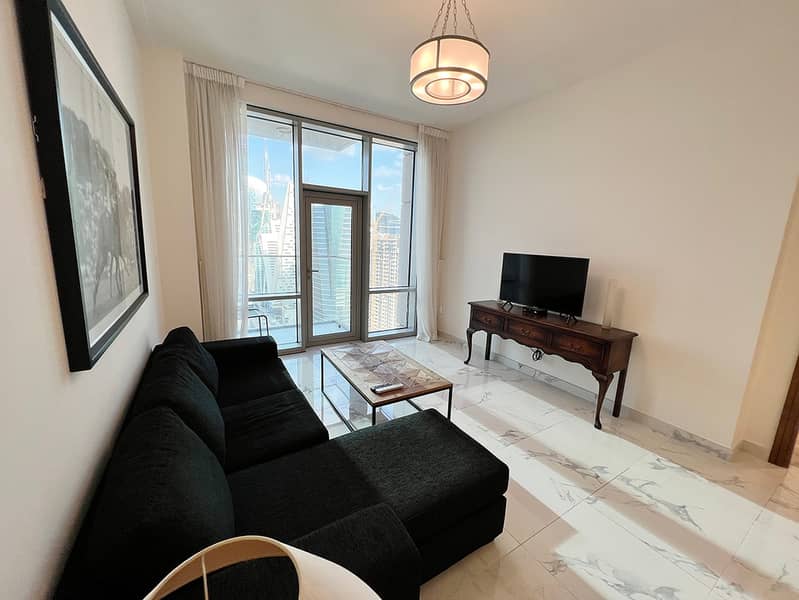 4 Noora Tower 1BR: Dubai Luxury with Pool & Gym