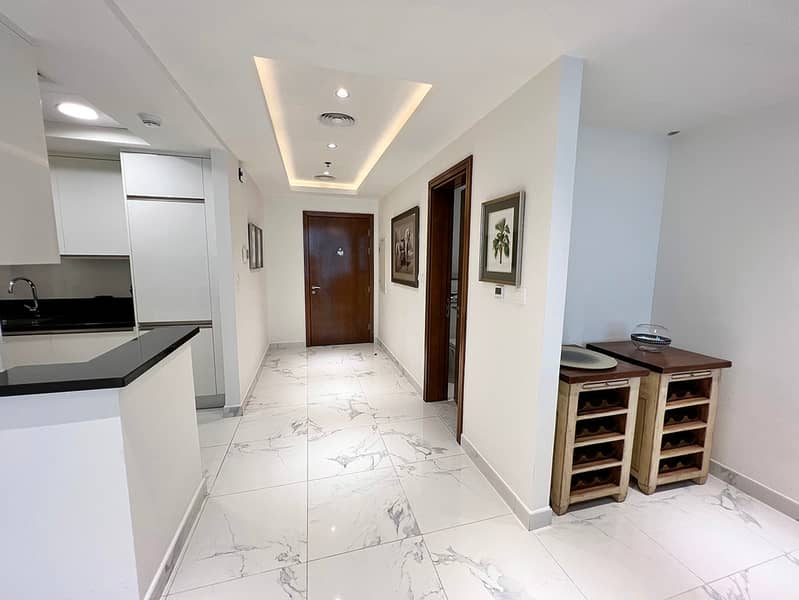9 Noora Tower 1BR: Dubai Luxury with Pool & Gym
