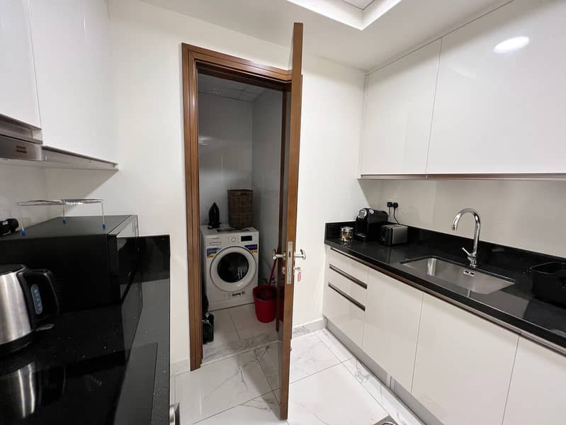 11 Noora Tower 1BR: Dubai Luxury with Pool & Gym