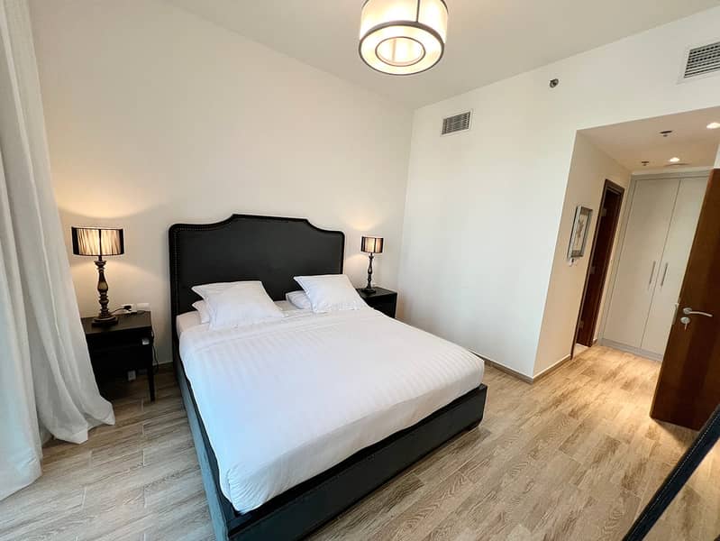 12 Noora Tower 1BR: Dubai Luxury with Pool & Gym