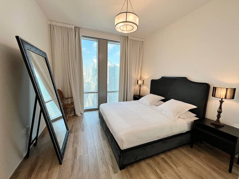 13 Noora Tower 1BR: Dubai Luxury with Pool & Gym