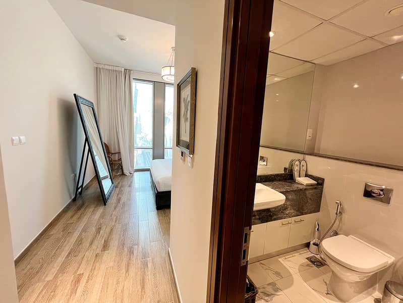 15 Noora Tower 1BR: Dubai Luxury with Pool & Gym
