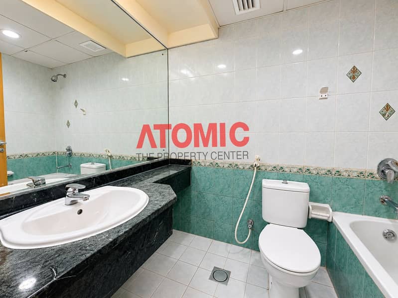 5 Bright Marble-Tiled Bathroom Interior. png