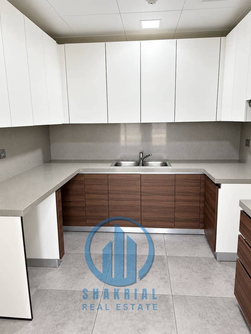 4 Minimalist U-Shaped Walnut Kitchen. png