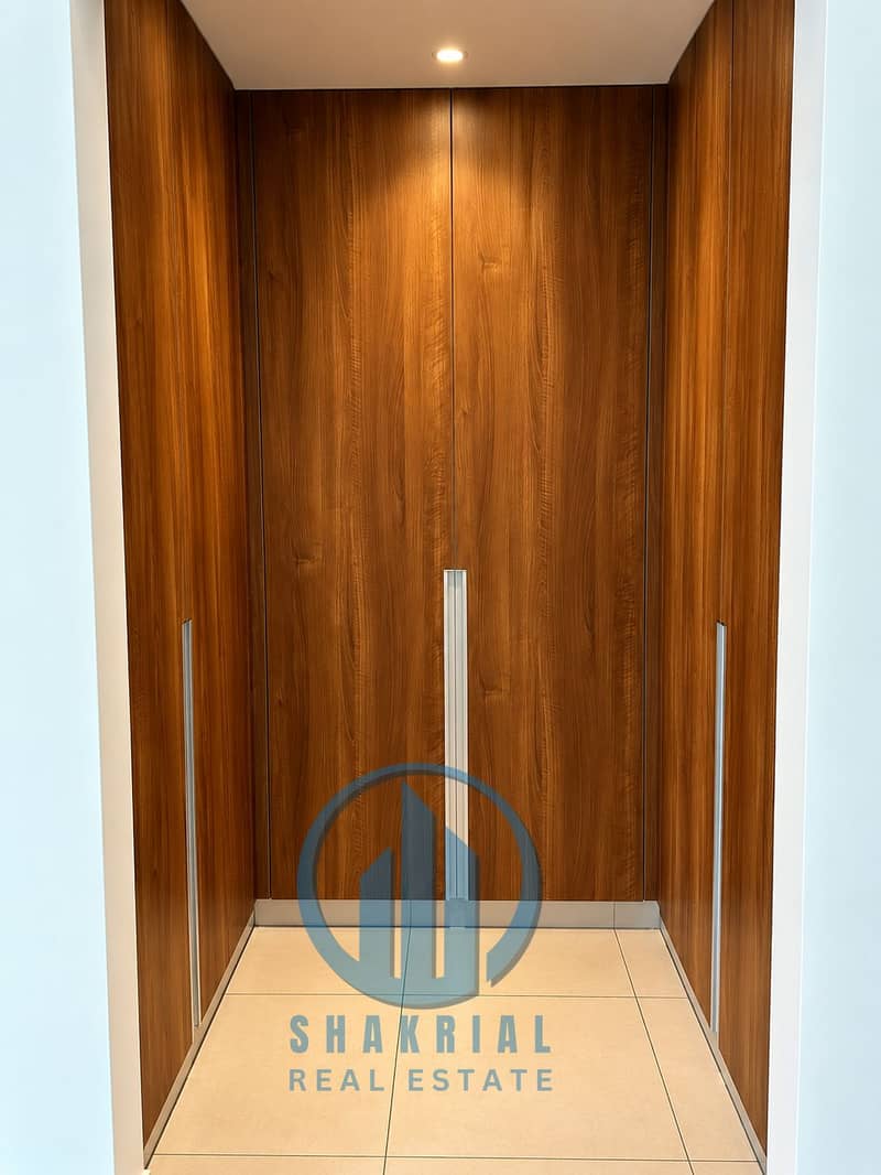 5 Symmetrical Walnut Walk-In Wardrobe. png